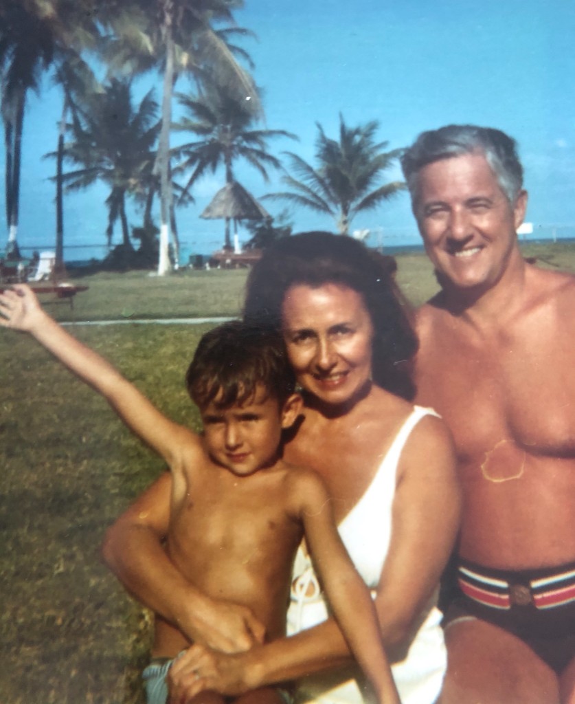 Family at the beach with palm trees